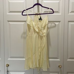 Yellow racerback lace-up sundress with ruffles